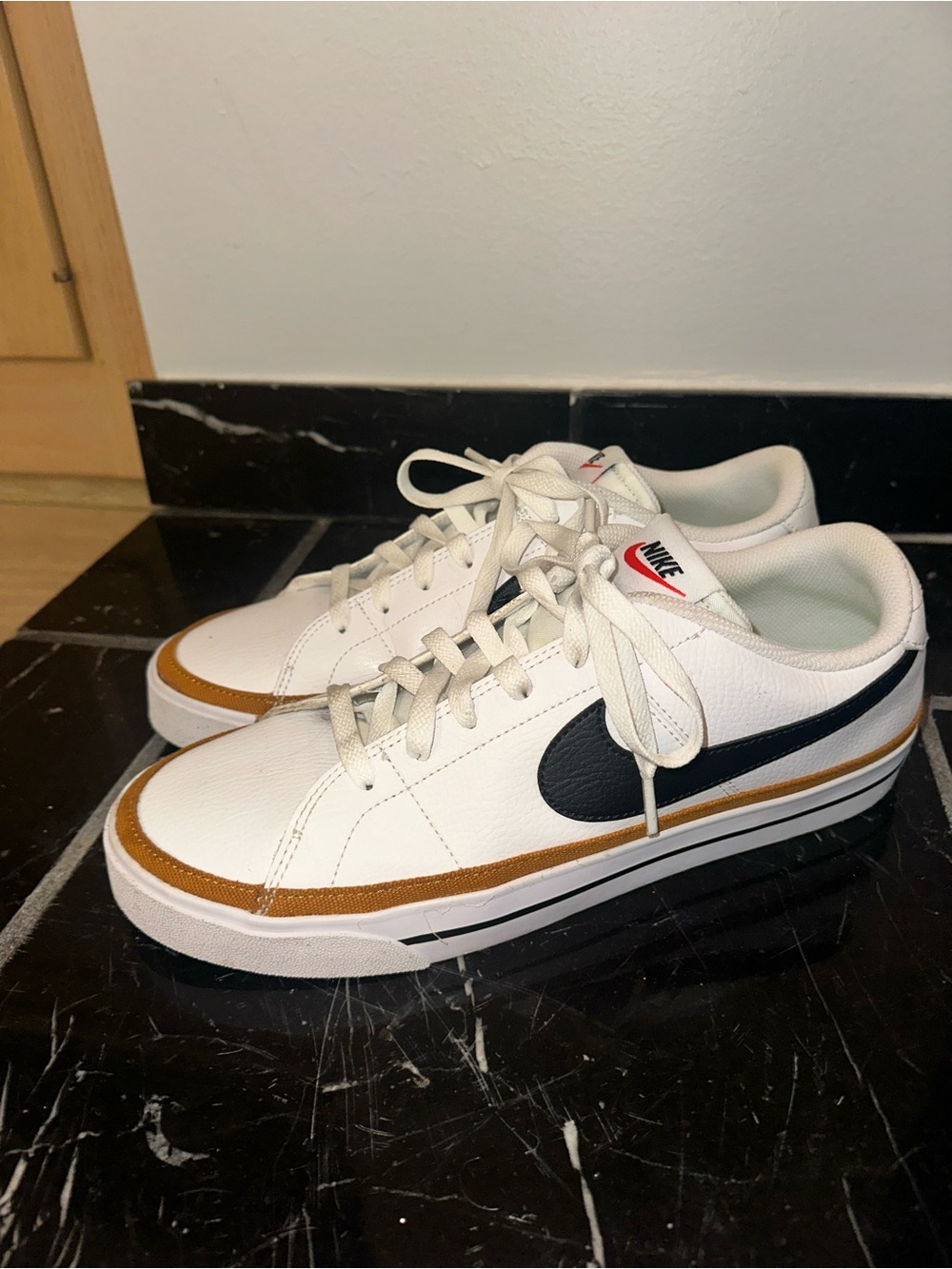 Nike Men’s White Low-Top Sneakers with Black Swoosh and Brown Trim